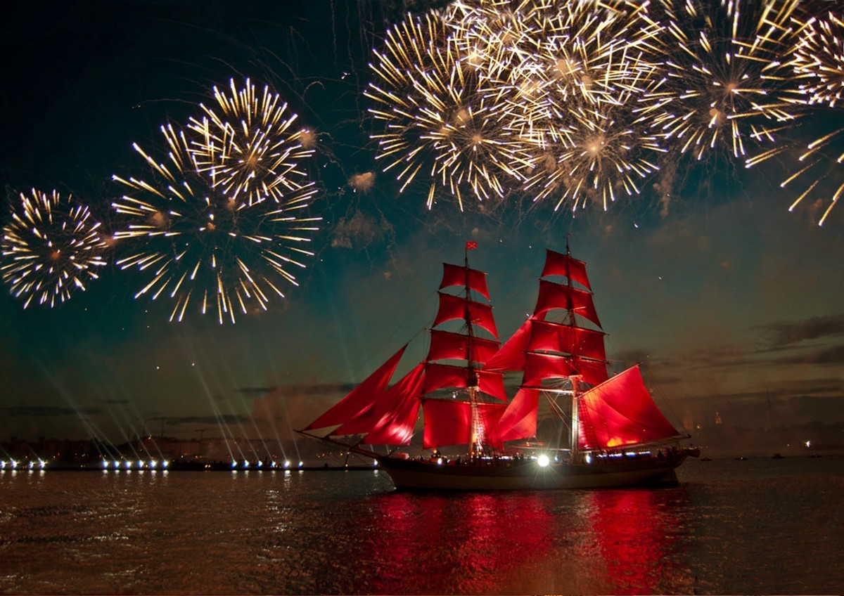 Scarlet Sailed ship sailing to the backdrop of fireworks