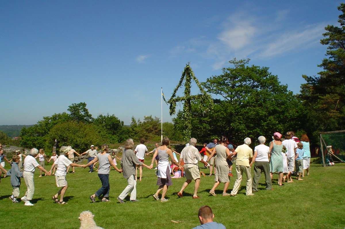 Dancing around a maypole in Sweden for summer solstice