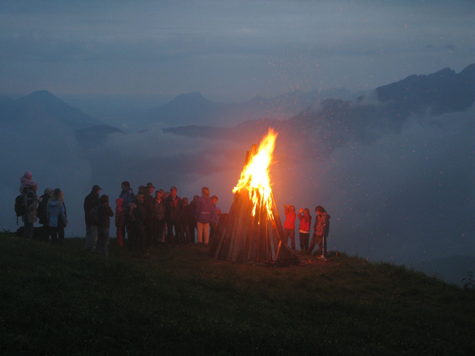 bonfire on a mountain in Austria during summer solstice